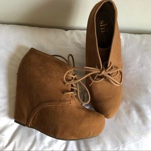Brown wedged heel booties